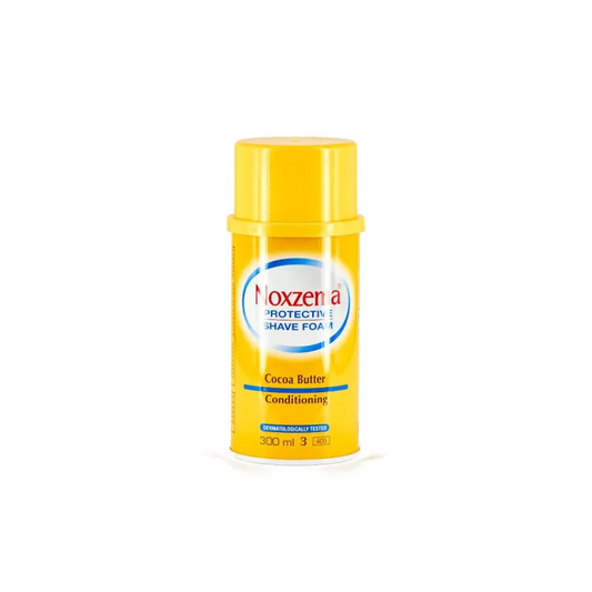 Espuma de afeitar Noxzema Protective Shave con manteca de cacao y vitamina E para pieles sensibles.